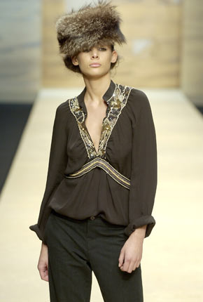 Black georgette embroidered V-neck top and black wool oxford pant