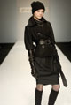 Black chunky wool jacket, black nappa leather trench belt and black wool twill wool tulip skirt  