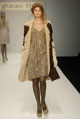 Brown curly merino sheepskin coat and silver jacquard flower lurex seamed tulip dress 