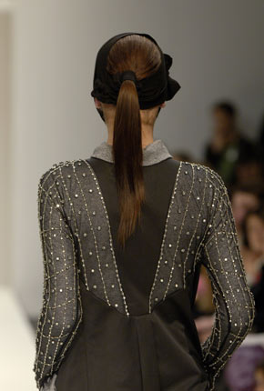 Purple wool knit diamond-ribbed top, purple stretch silk satin leaf detail skirt and black nappa leather trench belt  