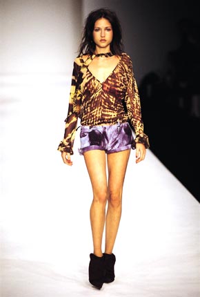 Animal print tie-neck top with open back and tie-dye suede army hot pants