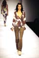 Muslin frill top. Suede fitted pants. African multi-coloured beaded belt